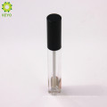 empty round clear lipstick container with black cap